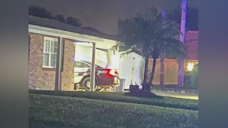 Titusville police car crashes into garage